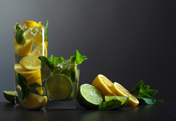 Drinks with fresh mint, lime, and lemon slices.