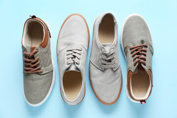 Casual male shoes on color background