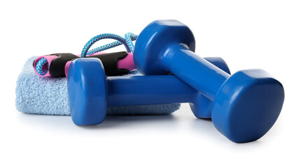 Dumbbells, towel and jumping rope on white background