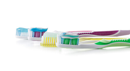 Toothbrushes with paste on white background