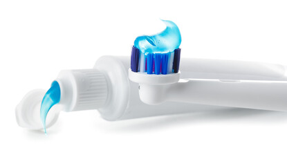 Toothbrush and paste on white background