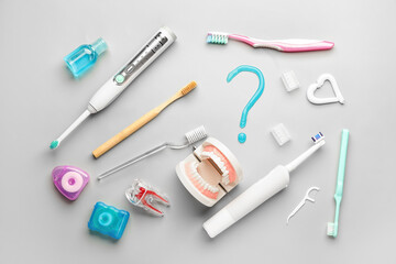 Set of oral hygiene and question mark on light background