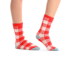 Legs of young woman in socks on white background