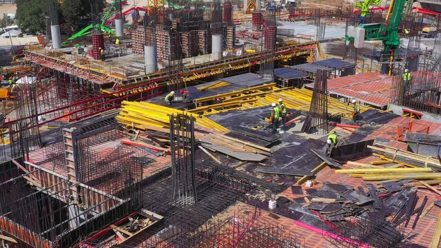 Mega Construction site with work in progress, Top down aerial view.