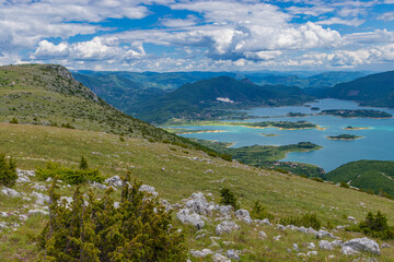 Naklejka na ściany i meble Aerial view of the lake in the mountains