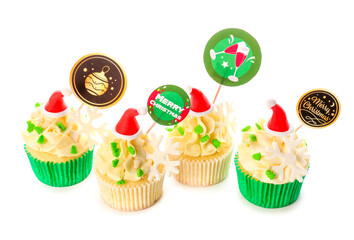 Tasty Christmas cupcakes on white background