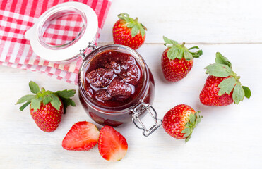 Delicious strawberry jam in a glass jar
