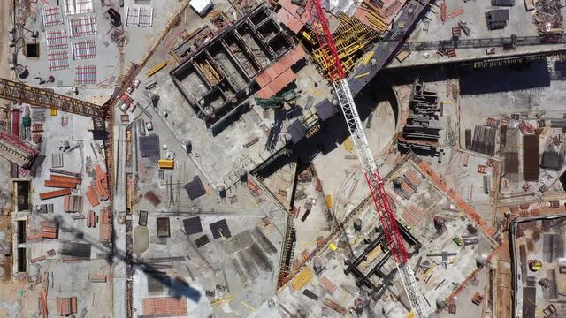 Mega Construction site with work in progress, Top down aerial view.