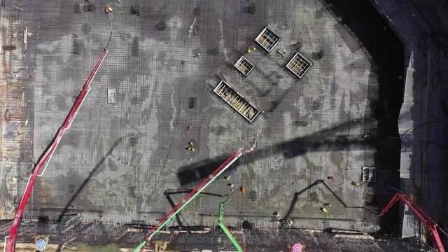 Mega Construction site with work in progress, Top down aerial view.