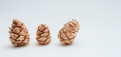 3 Christmas tree golden cones isolated on white background, graphic resources for design, overlay for photoshop. Concept of decorative New Year gifts 