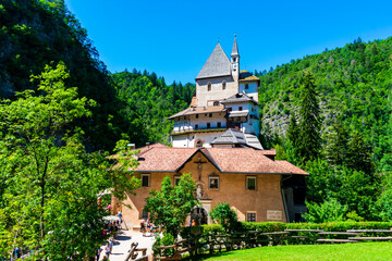 Fototapeta na wymiar Italy, Trentino, Sanctuary of San Romedio - 12 Juli 2020 - Front view of the sanctuary of San Romedio