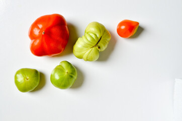 Seamless pattern with tomatoes. Abstract background. Tomato on the white background.