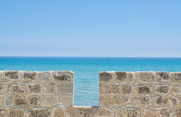 View of blue sea and wall  