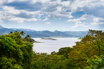 Amazing view of beautiful nature of Costa Rica with lake and forest near volcano Arenal in summer. La Fortuna, Costa Rica. Central America.