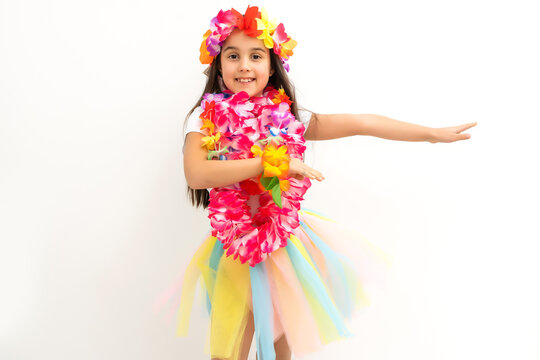 little girl in hawaiian costume isolated white background