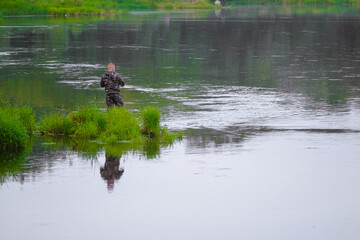 A man near the water. Fishing on the river