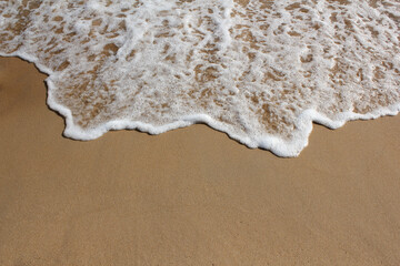 brown Sand beach and Wave foam.