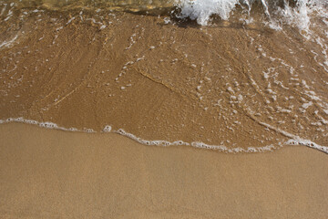 Sand beach and wave