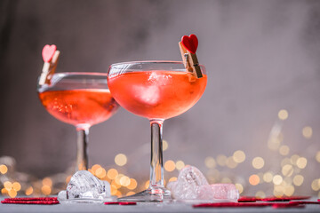 Festive pink cocktail with champagne or prosecco  for St. Valentine's day. Couple of glasses