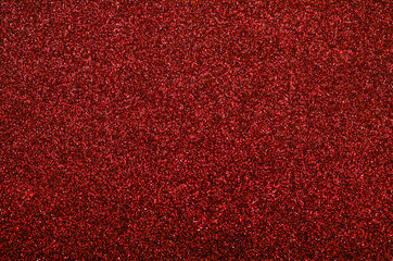 Shiny  bright holiday abstract red glitter texture background with a beige stripe.