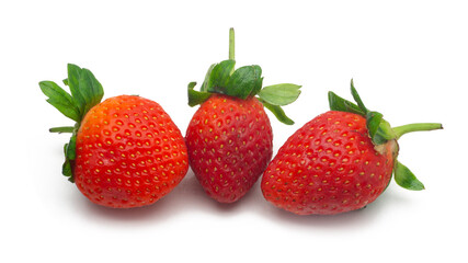 Close up view of three fresh red strawberries with leaves on isolated white background.