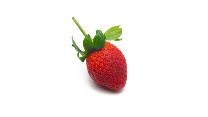 Close up view of a fresh red strawberries with leaves on isolated white background.