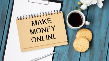 Make money online text on notepad and coffee