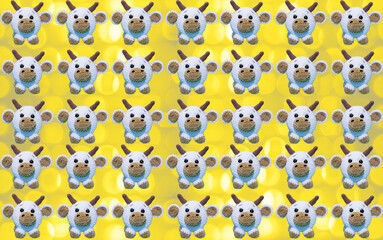 White Ox as a Christmas symbol on a bokeh wallpaper. Sparkle Illuminating yellow rounds on Ultimate Gray. Top view, flat lay. Christmas decorations. Minimal composition seamless pattern background.