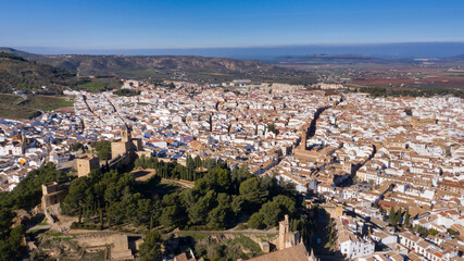 Aerial panorama drone views of Antequera, typical Andalusian city with castle on a hill in south Spain