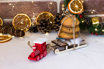 Christmas cookies with chocolate on sleds and red locomotive