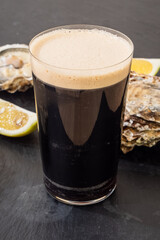 Raw Oyster and Stout with a Lemon Wedge, an Irish Cuisine Speciality