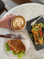 Several kind of Wonderfull dessert with top view on dish for breakfast as toast with fruity, Croissants and hot coffee or chocolate with woman hands