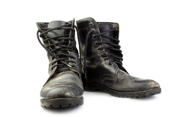 Old and torn black boots. isolated on a white background