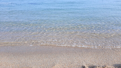 Soft beautiful ocean wave on sandy beach. Background