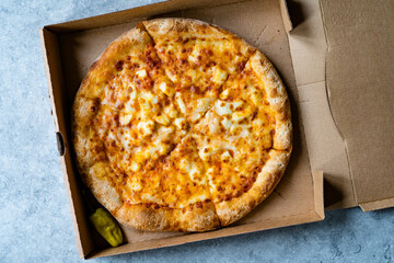 Take Away Pizza Quattro Formaggi Four Cheese Pizza in Box.