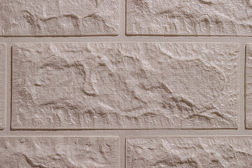 Imitation brick panel on the wall. Close up