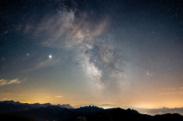 Fototapeta na wymiar Milky Way and Jupiter over the alps