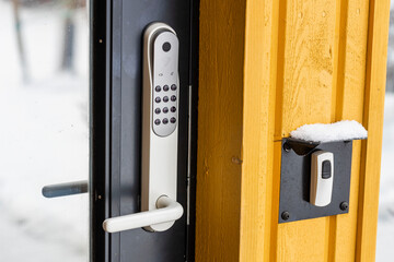 Close up view of an electric combination lock on a black door. Interior design. Beautiful backgrounds.