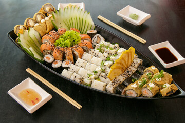 Beautiful and delicious varied sushi rolls on a stone board oporto portugal
