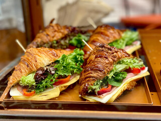 Croissant Sandwich for Sale in Display Showcase of Bakery Restaurant.