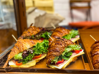 Croissant Sandwich for Sale in Display Showcase of Bakery Restaurant.