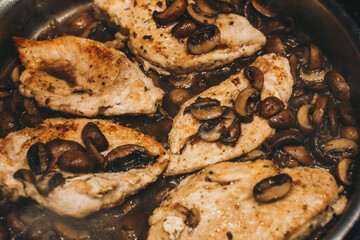 Chicken marsala with mushrooms in the pan