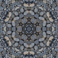  kaleidoscopic style of pebbles on a beach with colourful child's play fork and rake