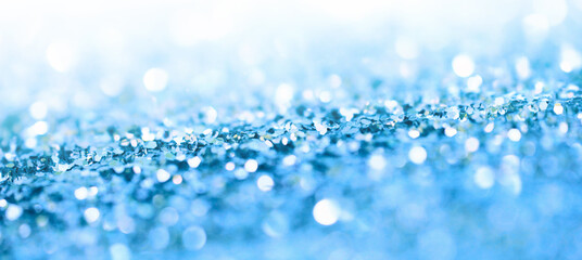 Soft de-focus backgound. Blue glitter shine dots confetti. Abstract light blink sparkle.