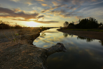 The puddles that come from the sea are very beautiful at sunset