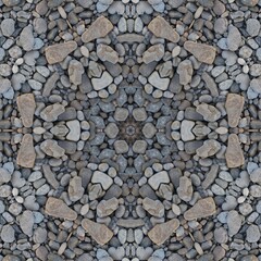  kaleidoscopic style of pebbles on a beach with colourful child's play fork and rake