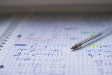 Office. Study. Pen on paper. Formula sheet. Mathematics. Notebook on rings.