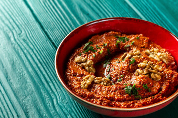 Roasted red bell pepper spread in a red bowl
