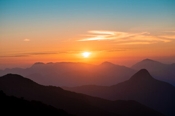 Colorful sunset on top of brazilian mountain - Serra dos Orgaos National Park, Petropolis, Rio de Janeiro, Brazil