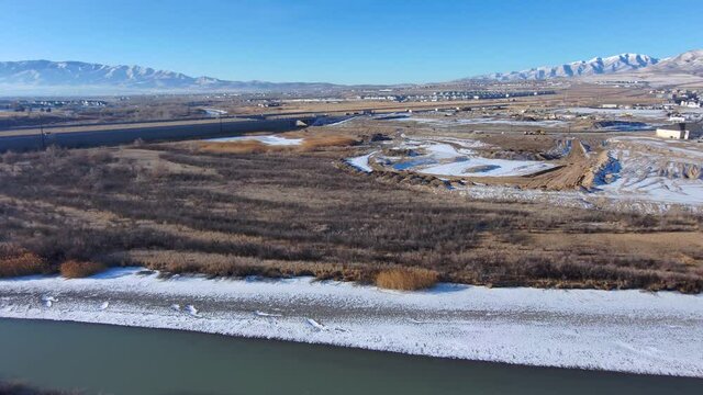 An Aerial View Of The Mountains, River And Countryside Then Turn To See Am Man Enjoying The View And Drinking Coffee From His Backyard Deck